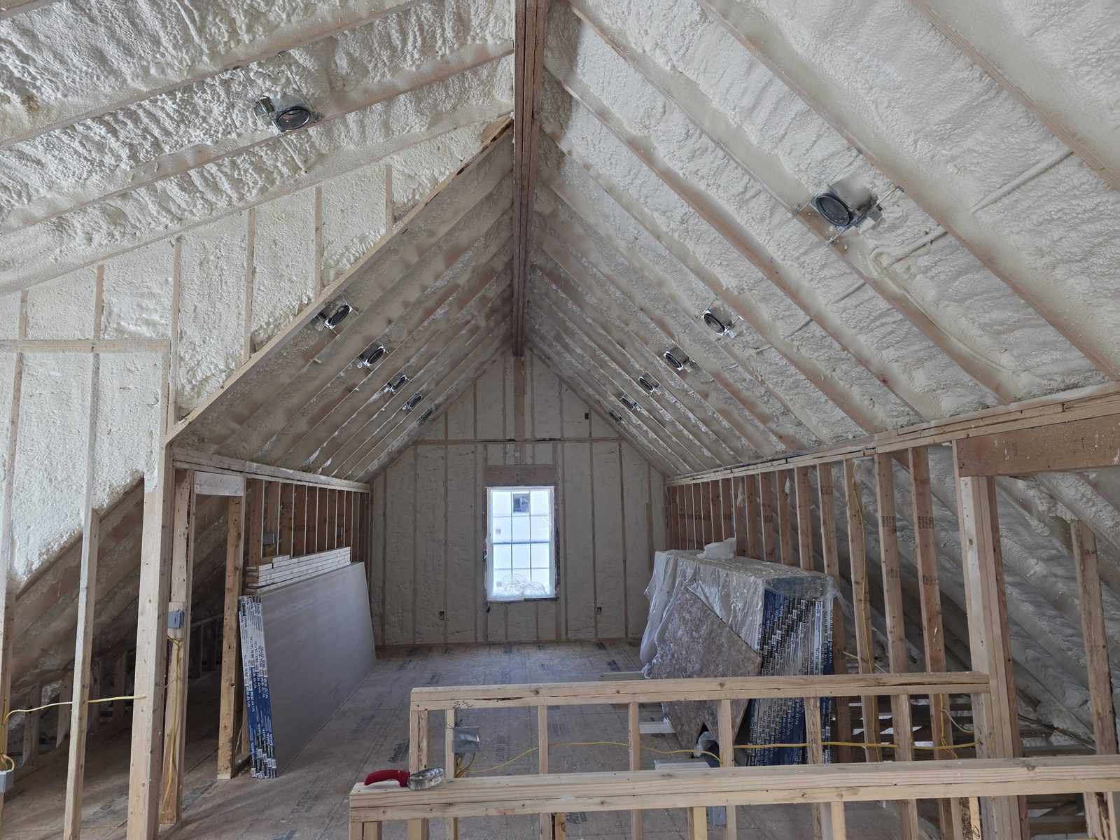 New construction interior framed and wired, ready for insulation.